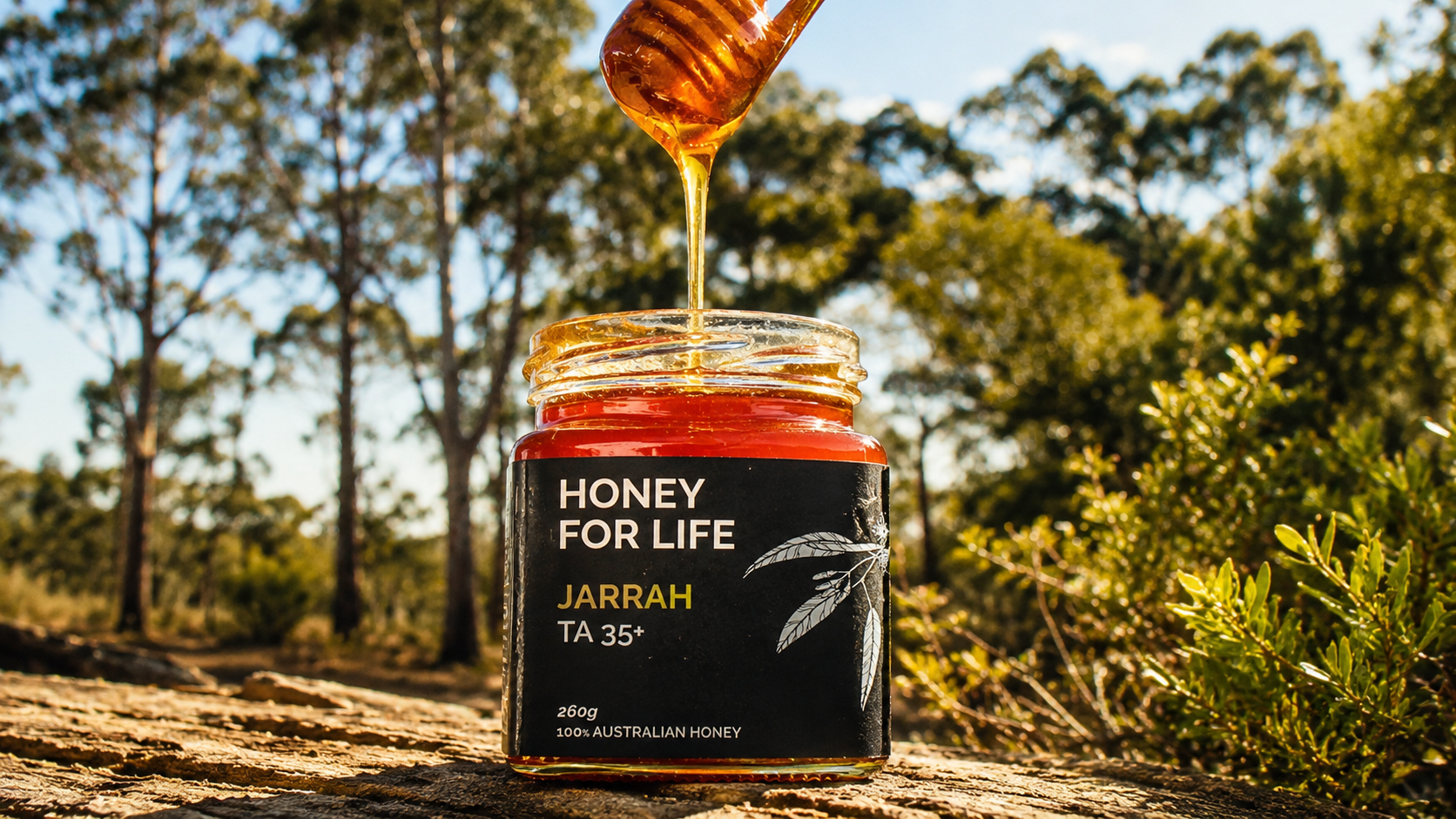 Honey For Life Jarrah TA 35+ honey jar with golden honey dripping against an Australian bushland backdrop