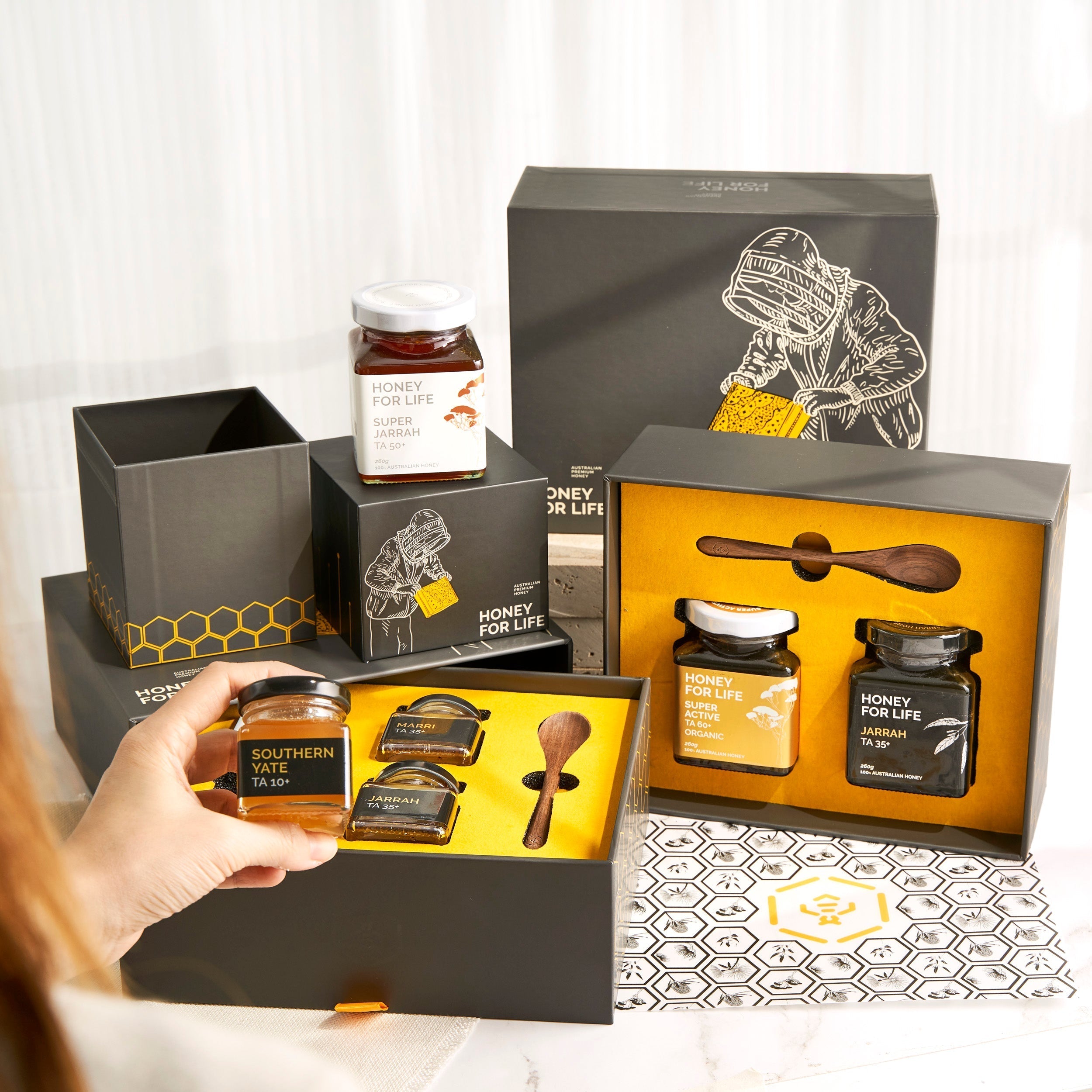 Premium corporate honey gift boxes with Jarrah honey, bioactive honey, wooden honey spoons and luxury packaging for client appreciation gifts, employee gifts and corporate gifting in Singapore.