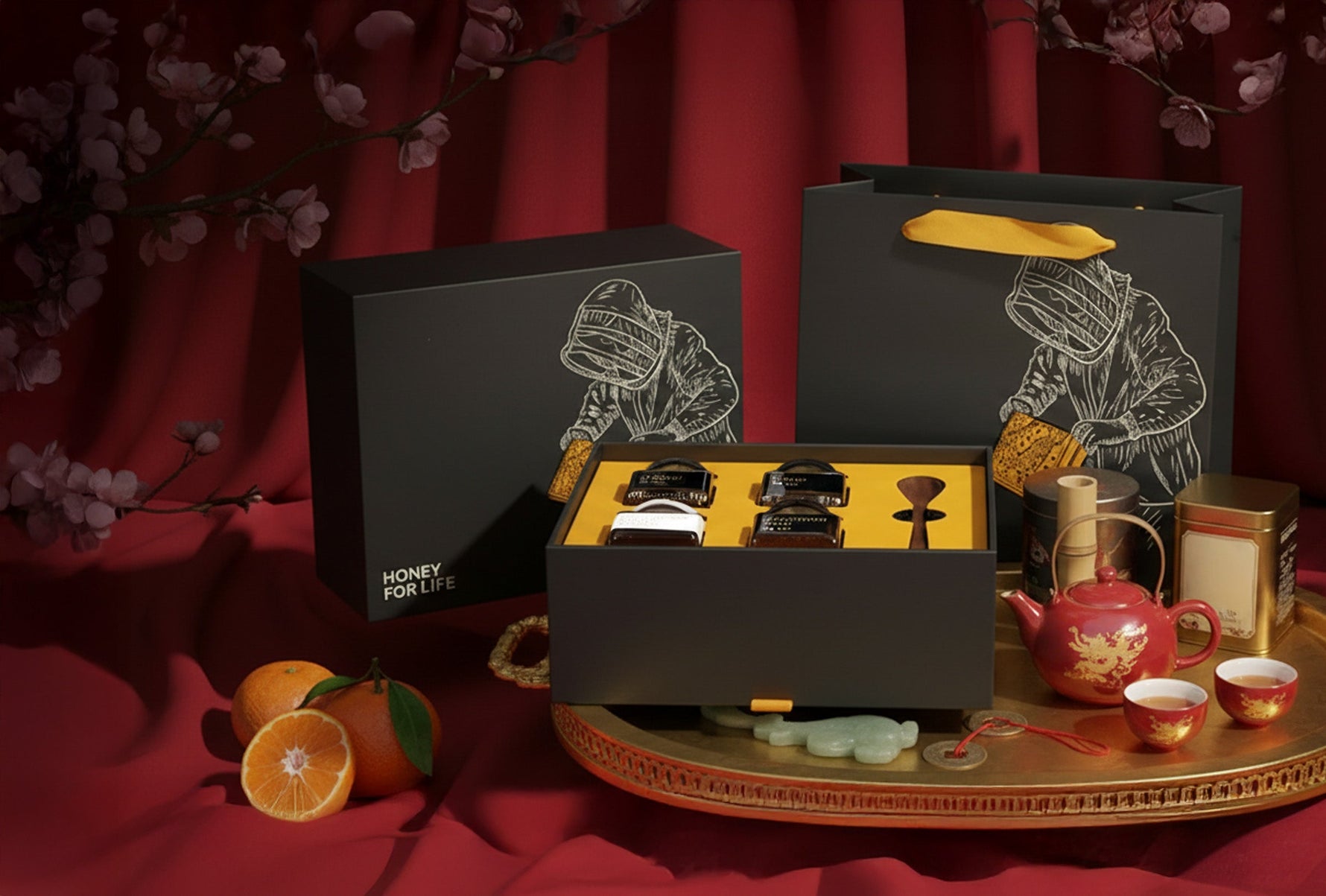 a gift box of fresh honey with fruits and tea cups on the table.