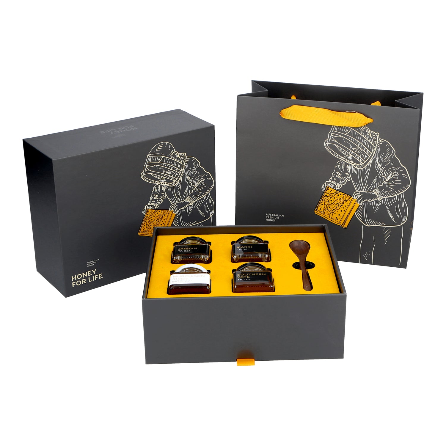 A limited edition gift set of honey jars. The set includes four small jars of honey, each labeled with different varieties such as Murchison River MGO100+, Marri TA35+, Jarrah TA35+, and Southern Yate.