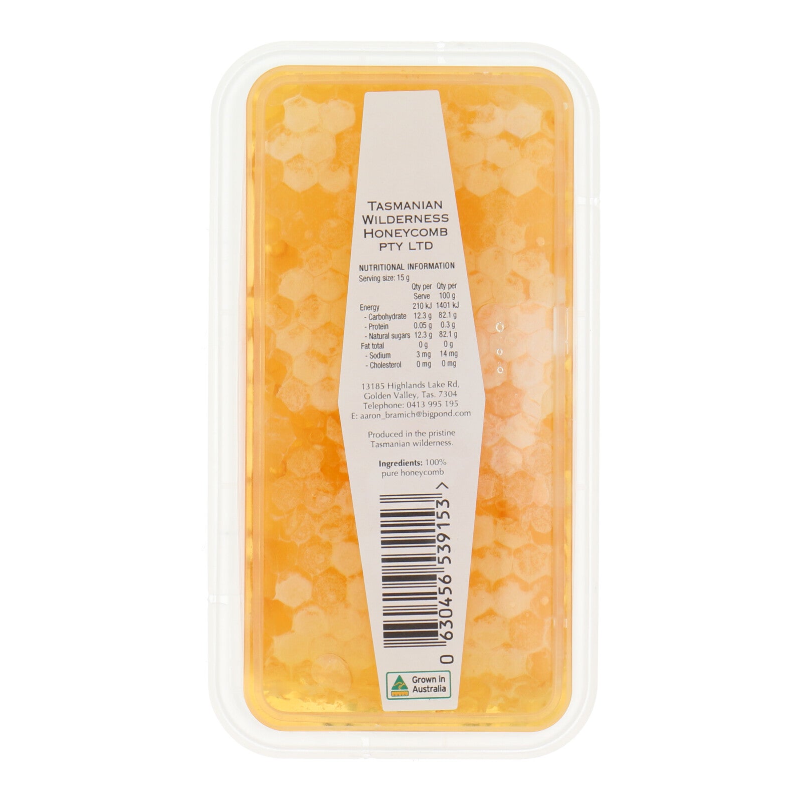 Packaged Tasmanian wilderness honeycomb with a label on a white background