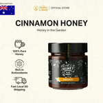 Jar of cinnamon honey from The Honey Colony with product details on a beige background