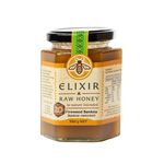A jar of Elixir Raw Honey with the label Firewood Banksia, indicating it is a honey product with the weight 380g.