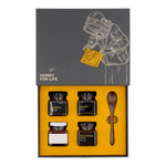 The Petite Four Honey Gift Set with open box showing 4 honey jars and a wooden spoon