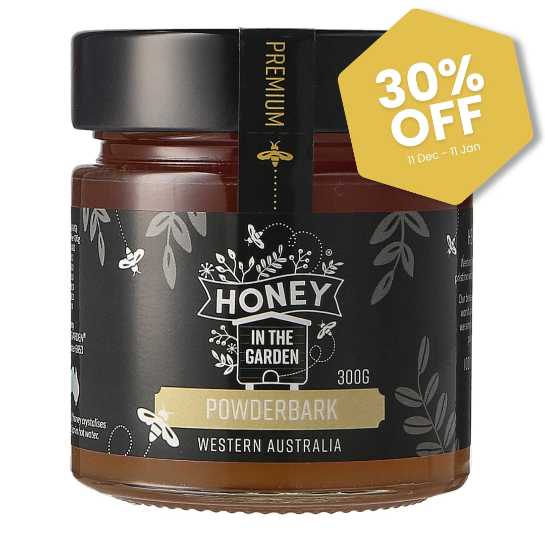 Jar of honey with 'Honey in the Garden Powderbark' label and a 30% off tag on a white background