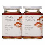 Two glass jars of 'Honey For Life' Super Jarrah TA 50+ honey with white lids, arranged side-by-side on a white background.