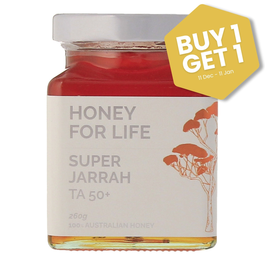 Jar of 'Honey for Life Super Jarrah' honey with a 'Buy 1 Get 1' offer label.