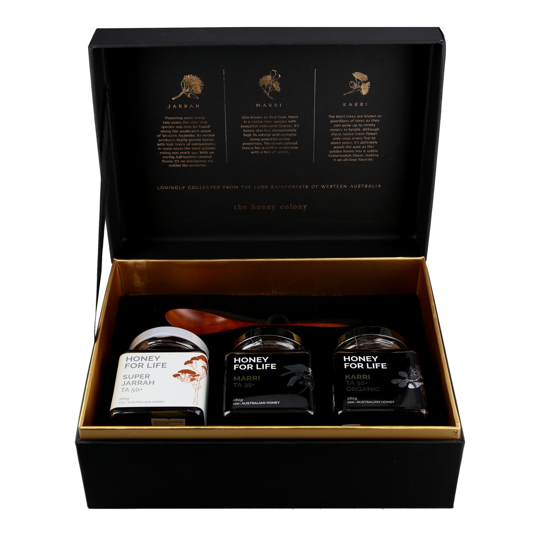 Super Honey Gift Box showing 3 honey jars and a wooden spoon inside
