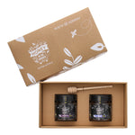 Two jars of honey in a box gift set, one labeled Blackbutt TA30+ and one Marri TA30+, presented in a cardboard gift box with a honey dipper on top, all against a white background.