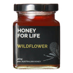 A jar of Australian Wildflower honey with a label that reads 'HONEY FOR LIFE' and 'WILDFLOWER'. The honey is presented in a clear jar showing its light amber color, and the packaging indicates the brand and product name.